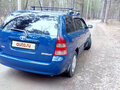 2004 Toyota Corolla IX (E120, E130), синий - вид 3