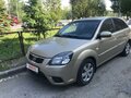 2010 Kia Rio II Рестайлинг, золотистый, 750000 рублей - вид 1