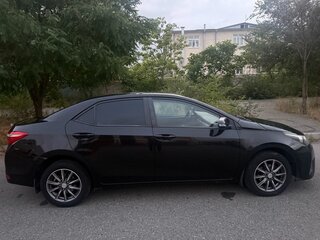 2014 Toyota Corolla XI (E160, E170, E180), чёрный, 1250000 рублей, вид 2