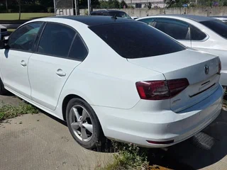 2016 Volkswagen Jetta VI Рестайлинг, белый, 913000 рублей, вид 2