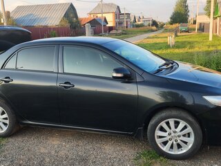 2010 Toyota Corolla X (E140, E150) Рестайлинг, чёрный, 1050000 рублей, вид 2