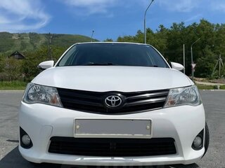 2012 Toyota Corolla Axio XI (E160, E170, E180), белый, 1050000 рублей, вид 2