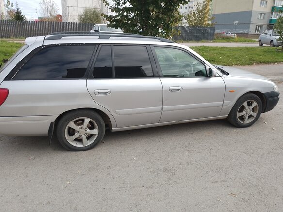 2001 Mazda Capella VI, серый - вид 2
