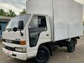 1991 Isuzu Elf (N-series), белый, 465000 рублей - вид 2
