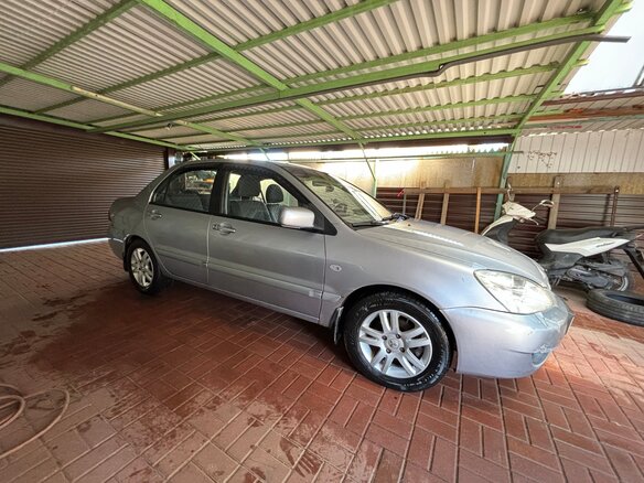2006 Mitsubishi Lancer IX Рестайлинг, серебристый, 400000 рублей - вид 1