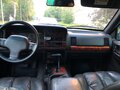 1997 Jeep Grand Cherokee I (ZJ) Рестайлинг, зелёный - вид 11