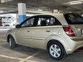 2010 Kia Rio II Рестайлинг, золотистый, 595000 рублей - вид 5