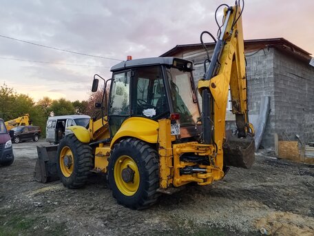 2005 New Holland B115B, жёлтый, 3150000 рублей, вид 2