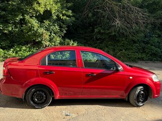 2011 Chevrolet Aveo I Рестайлинг, красный, 530000 рублей, вид 3