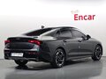 2024 Kia K5 III Рестайлинг, чёрный - вид 1