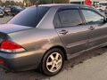 2007 Mitsubishi Lancer IX Рестайлинг, серый, 210000 рублей - вид 2