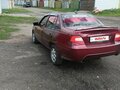 2009 Daewoo Nexia I Рестайлинг, пурпурный, 180000 рублей - вид 6