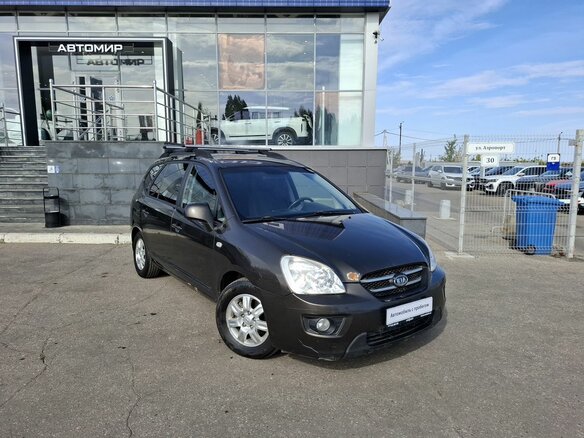 2010 Kia Carens II (UN), коричневый, 740000 рублей - вид 2