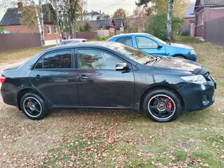 2010 Toyota Corolla X (E140, E150) Рестайлинг, чёрный, 700000 рублей, вид 2