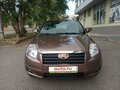 2013 Geely Emgrand X7 I, коричневый, 900000 рублей - вид 1