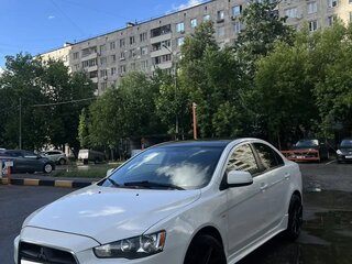 2011 Mitsubishi Lancer X Рестайлинг, белый, 799999 рублей, вид 1