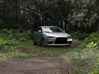 2012 Mitsubishi Lancer X Рестайлинг, серебристый, 700000 рублей, вид 4
