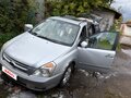 2009 Kia Carnival Grand II, серый, 900000 рублей - вид 1