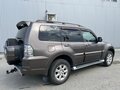 2011 Mitsubishi Pajero IV Рестайлинг 1, коричневый, 2000000 рублей - вид 7
