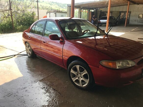 1996 Ford Escort (North America) III, красный - вид 4