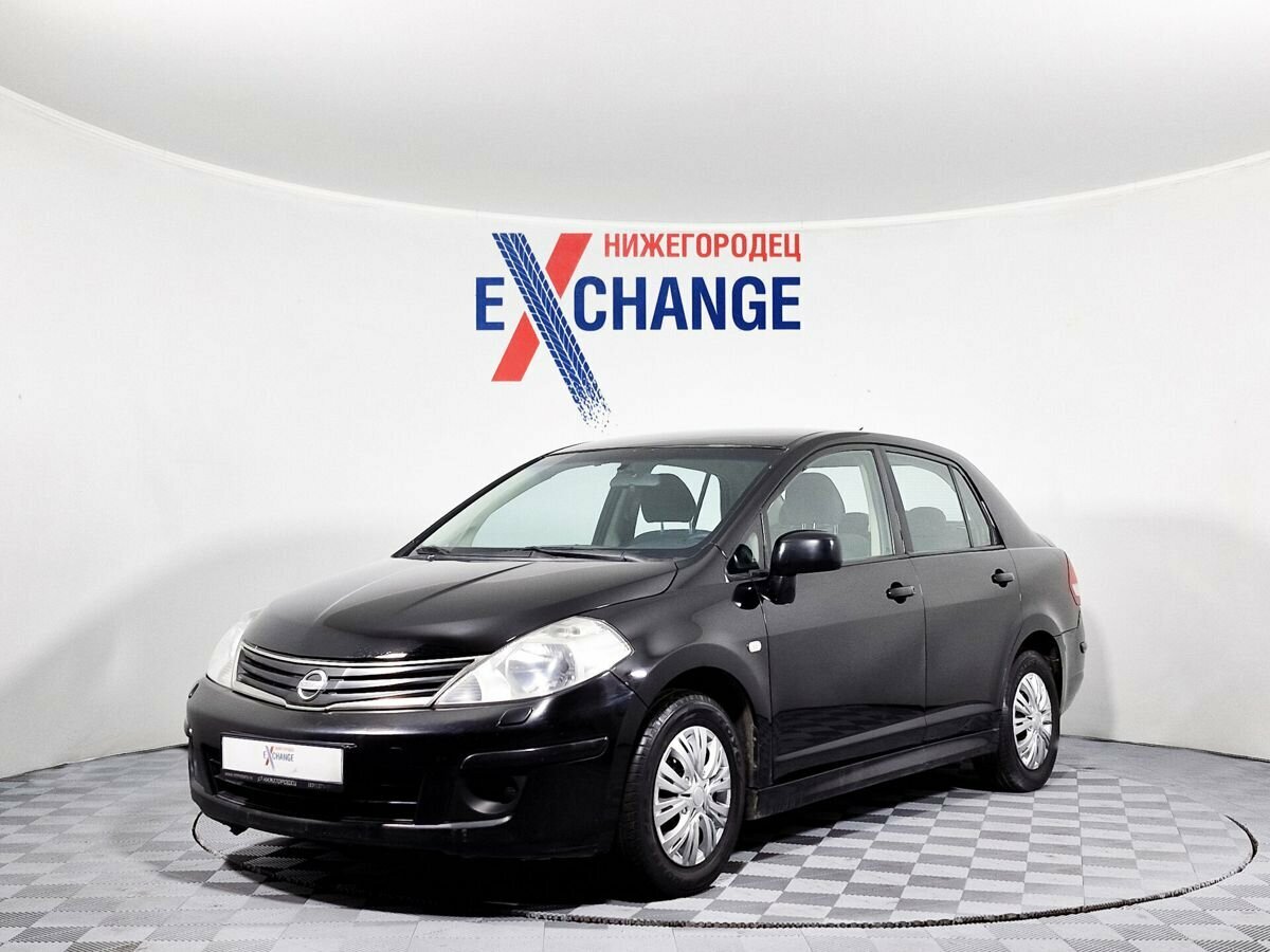 Открыть фотографии: Nissan Tiida I Рестайлинг