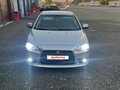 2012 Mitsubishi Lancer X Рестайлинг, серебристый, 720000 рублей - вид 1