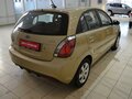 2010 Kia Rio II Рестайлинг, бежевый - вид 3