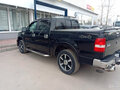 2005 Ford F-150 XI, чёрный - вид 1
