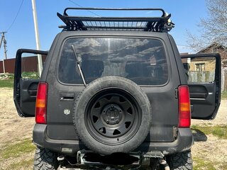 2009 Suzuki Jimny Kei car III Рестайлинг 1, чёрный, 650000 рублей, вид 3