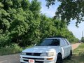 1997 Toyota Corolla VII (E100), белый, 420000 рублей