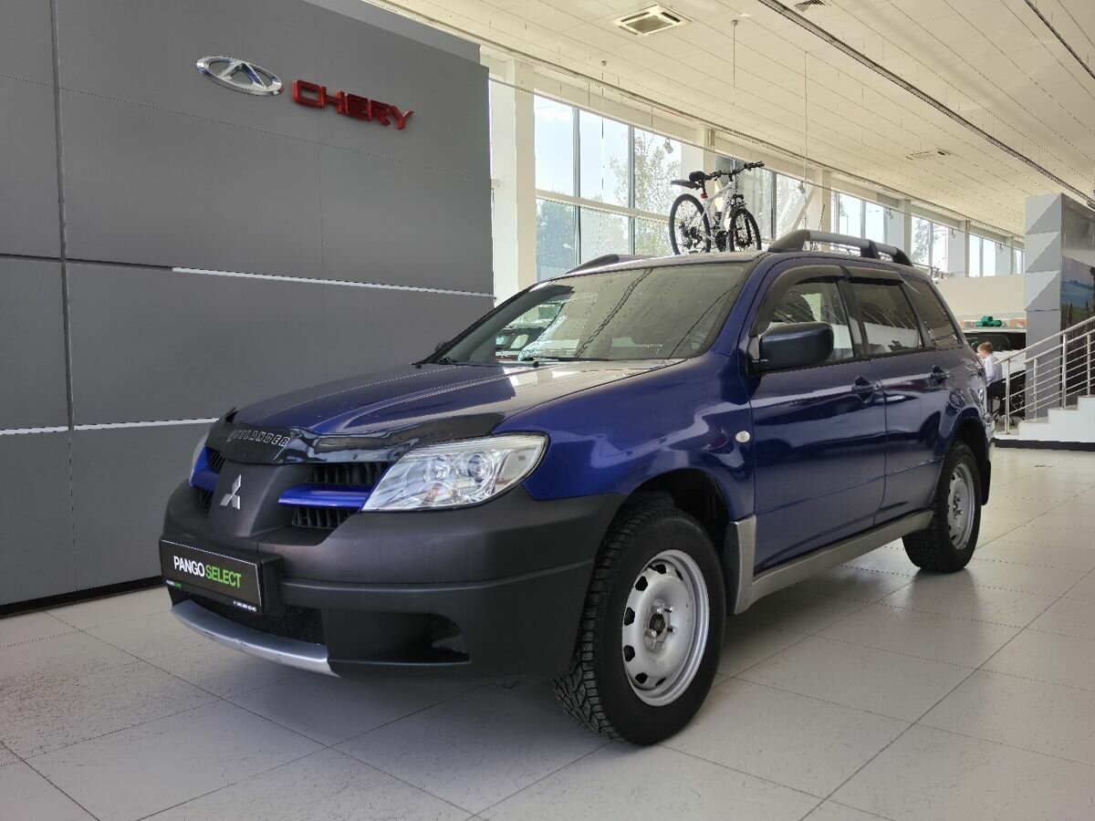 Открыть фотографии: Mitsubishi Outlander I