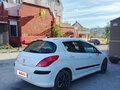 2010 Peugeot 308 I, белый - вид 4