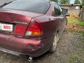 1998 Mitsubishi Carisma I, красный - вид 4