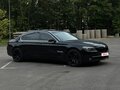 2011 BMW 7 серии 750i xDrive V (F01/F02/F04), чёрный - вид 2