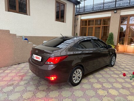 2014 Hyundai Solaris I Рестайлинг, коричневый, вид 3
