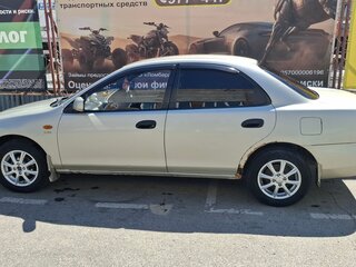 1995 Mazda Familia VII (BH), золотистый, 155000 рублей, вид 5