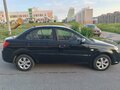 2010 Kia Rio II Рестайлинг, чёрный, 380000 рублей - вид 2