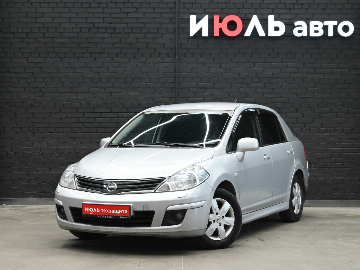 Открыть фотографии: Nissan Tiida I