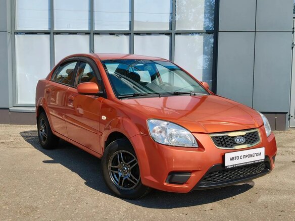 2010 Kia Rio II Рестайлинг, оранжевый - вид 2