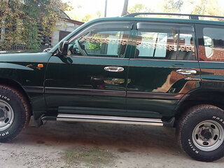 2005 Toyota Land Cruiser 105 100 Series Рестайлинг 1, зелёный, 7500000 рублей, вид 4