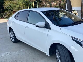 2013 Toyota Corolla XI (E160, E170, E180), белый, 1750000 рублей, вид 2