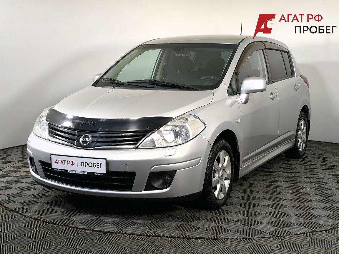 Открыть фотографии: Nissan Tiida I