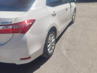 2013 Toyota Corolla XI (E160, E170, E180), белый, 1500000 рублей, вид 2