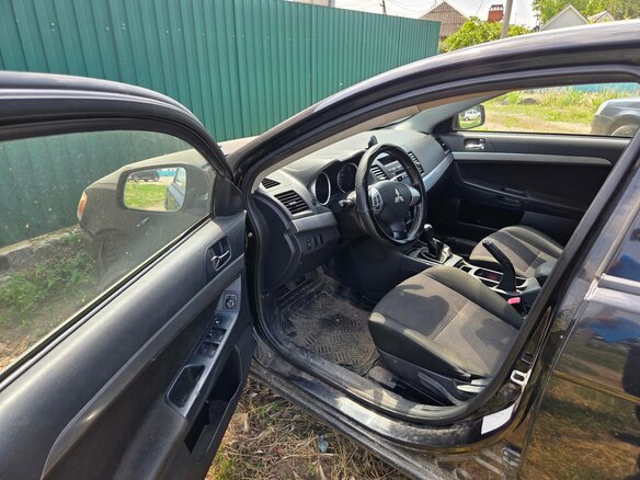 2010 Mitsubishi Lancer X, чёрный, 414000 рублей - вид 6