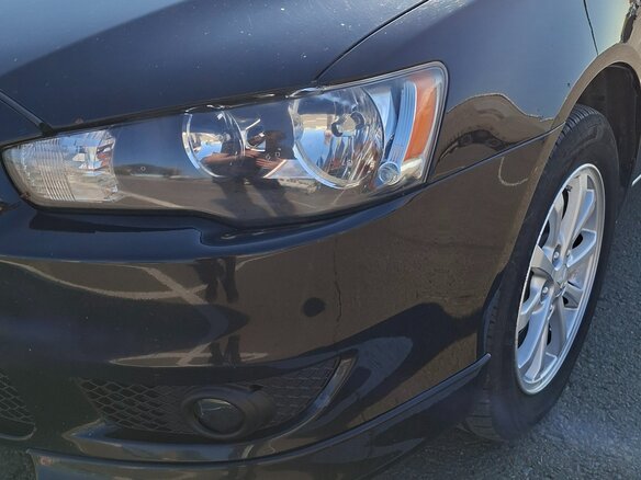 2010 Mitsubishi Lancer X, чёрный, 629000 рублей - вид 4