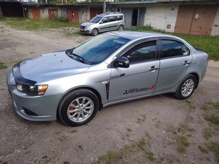 2012 Mitsubishi Lancer X Рестайлинг, серебристый, 730000 рублей, вид 2