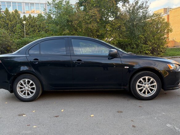 2013 Mitsubishi Lancer X Рестайлинг, чёрный, 840000 рублей - вид 3