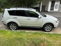 2011 Mitsubishi Outlander II Рестайлинг, белый, 1200000 рублей - вид 3