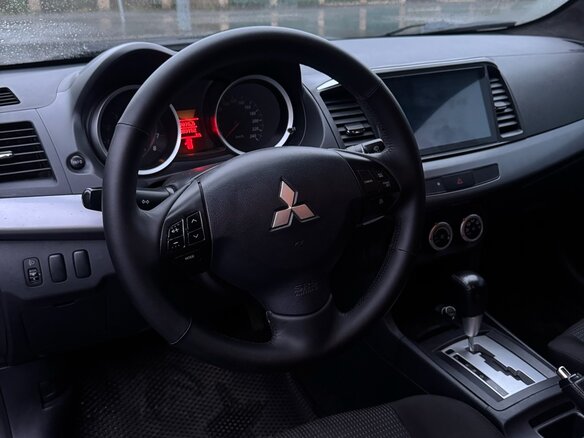 2010 Mitsubishi Lancer X, чёрный, 685000 рублей - вид 11