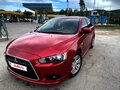 2012 Mitsubishi Lancer X Рестайлинг, красный, 1050000 рублей - вид 2